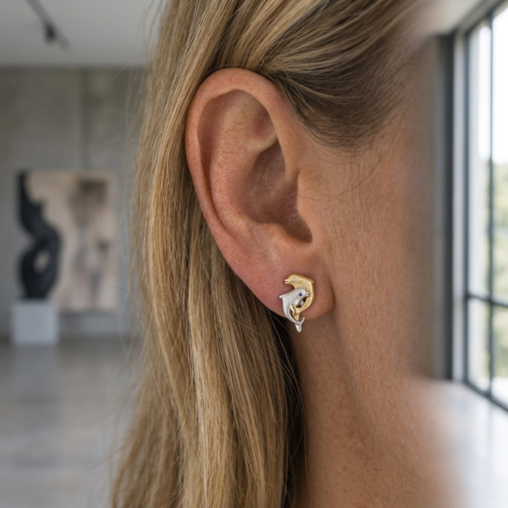 14k 2/tone 15mm "Dancing Couple" Dolphin Earrings — worn on model (blonde, view 2)