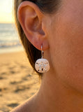 15mm 14k Sand Dollar Earring with 10 diamonds — close-up on model