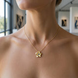 14k 8mm Plumeria Slide with Blue Diamond — worn on model (blonde, view 2)