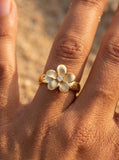 10mm 14k Plumeria Ring with 0.03 Carat Diamond — close-up on model
