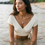 14k 2/tone Lobster Pendant with 2 Diamonds and 16 Pastel Pink Sapphires — worn on model (brunette, view 2)