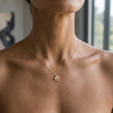 14k 15mm Plumeria Slide with 0.04 carats diamond — worn on model (brunette, view 2)