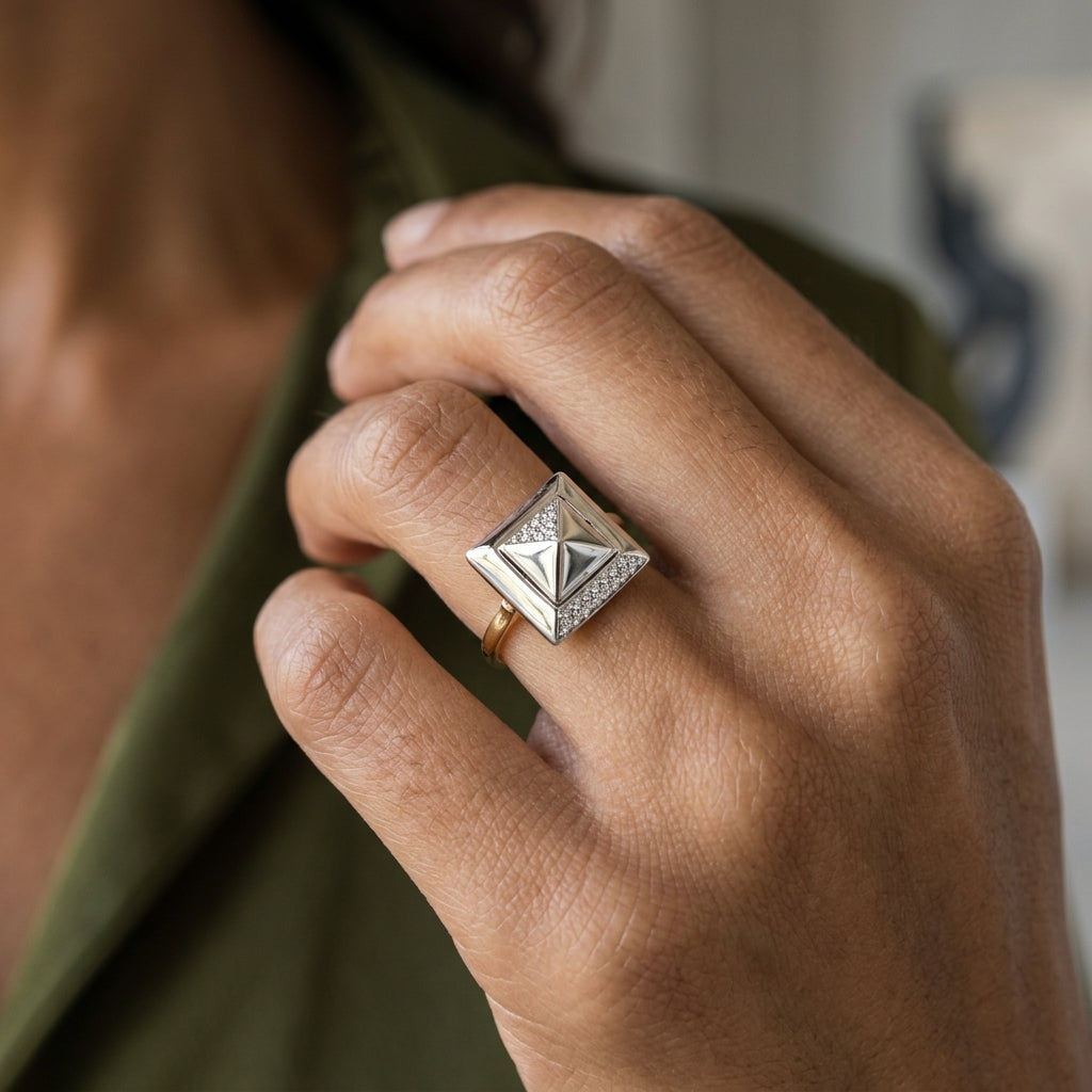 14K YELLOW AND WHITE GOLD DOUBLE PYRAMID SPINNER RING WITH 0.15CTW — worn on model (brunette, view 4)