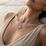 14k 2/tone "Compass Rose" Pendant with 17 Diamonds and 4 Tanzanites — worn on model (brunette, view 4)