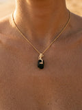 14ky Mermaid Pendant with Black Tourmaline — close-up on model
