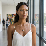 14ky Mermaid Pendant with Tahitian Pearl 11mm — worn on model (brunette, view 1)