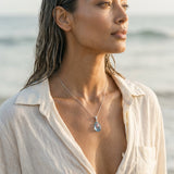 18k 2/Tone Pendant with 4 Diamonds .02ct, Pink Sapphire .11ct, Blue Topaz 3.15ct — worn on model (brunette, view 4)